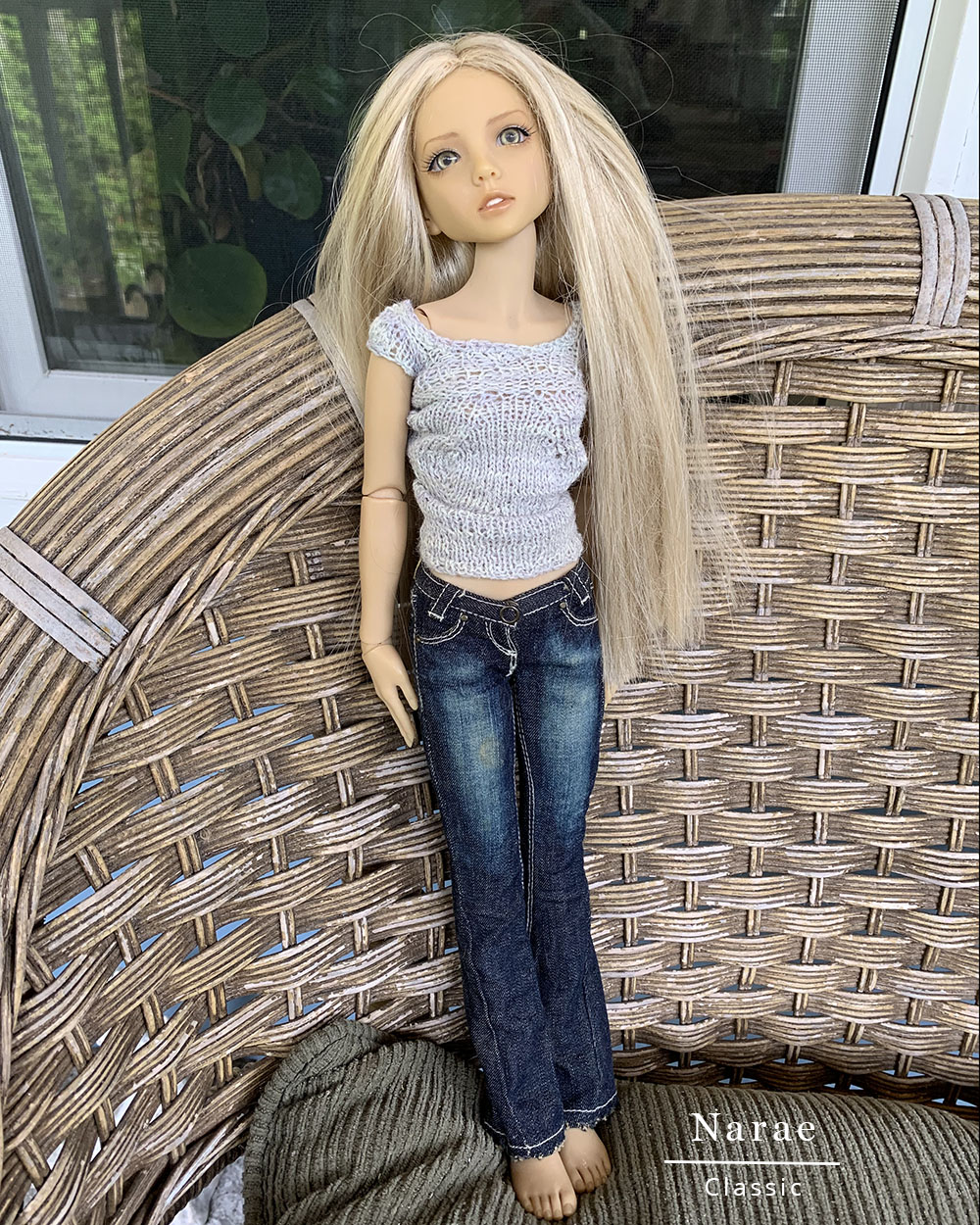 This Narae's doll clothes include a handmade sweater and jeans.